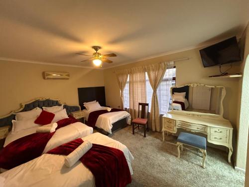 Postel nebo postele na pokoji v ubytování M&D Guest House