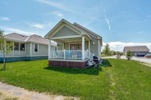 a small house with a porch and a yard at The Violet - 42 Meadow View in Cherry Valley