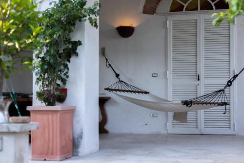 a hammock hanging from a wall in a house at Therme Appiae in Rome