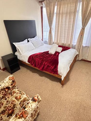 Postel nebo postele na pokoji v ubytování M&D Guest House
