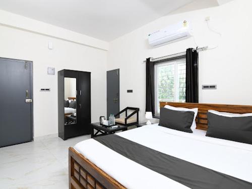 Postel nebo postele na pokoji v ubytování SS INN Hotel