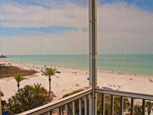 a view of a beach from a balcony at Crescent Arms Condominiums in Siesta Key