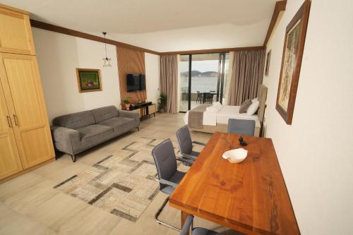 a living room with a table and a couch at Suites Castello in Bar