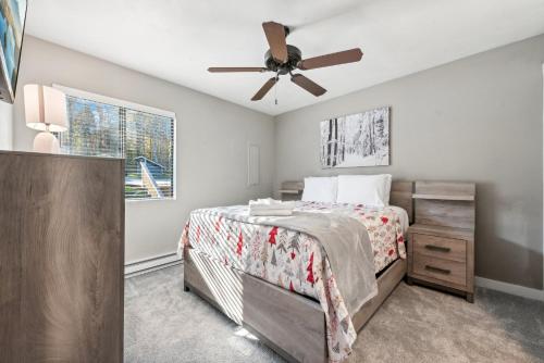 a bedroom with a bed and a ceiling fan at 3BR Ski Resort Townhome-Sleeps 7 in Somerset