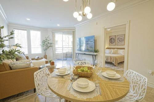 a living room with a table and chairs and a couch at Dwell Descans - Restful Haven Steps to Vegas Strip in Las Vegas