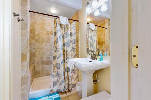 a bathroom with a sink and a shower at Ocean Colony 3 in Ocean City