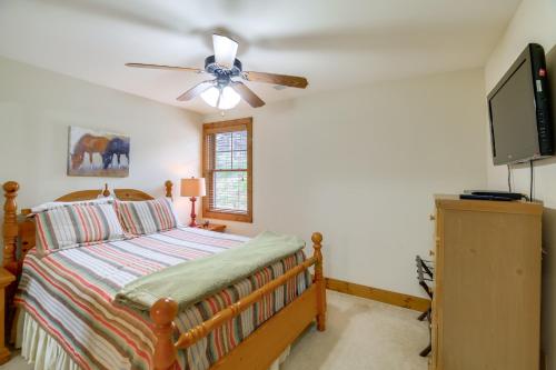 a bedroom with a bed and a ceiling fan at Mountain Condo 2 Mi to Dtwn Banner Elk with Views! in Banner Elk