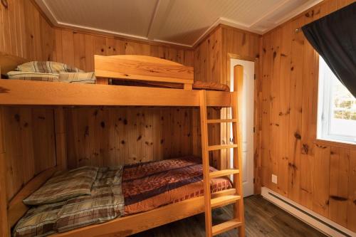 Ένα ή περισσότερα κρεβάτια σε δωμάτιο στο Chalet des Boisés 9