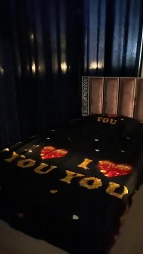 a dark room with a table with a sign that says party at فيلا دوبلكس في العين السخنة في قرية بلو باي أسيا عروس السخنة in Ain Sokhna