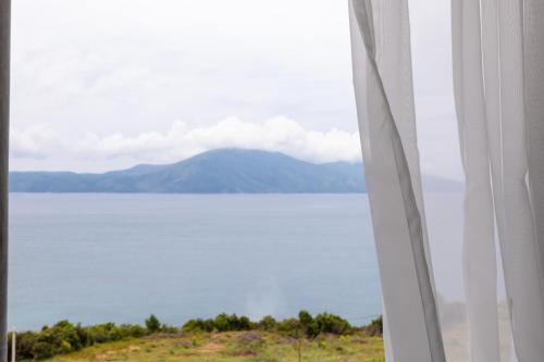 a view of a large body of water from a window at Hotel Majestic in Vlorë