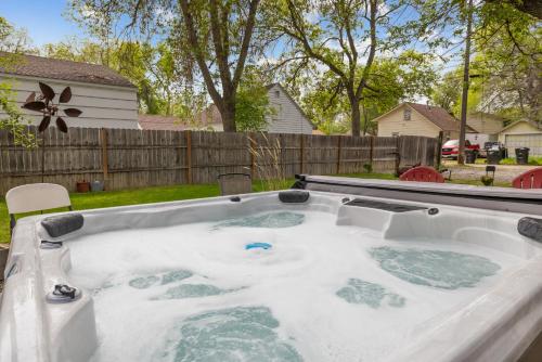 a jacuzzi tub in the backyard of a house at Bo's Rusty Relic Central Billings near park, hospital, shared hot tub, sauna in Billings