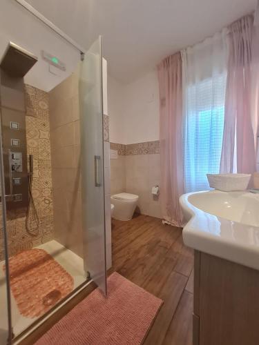 a bathroom with a shower and a sink and a toilet at La Chicca di Milu' for Pet Lovers in Alcamo