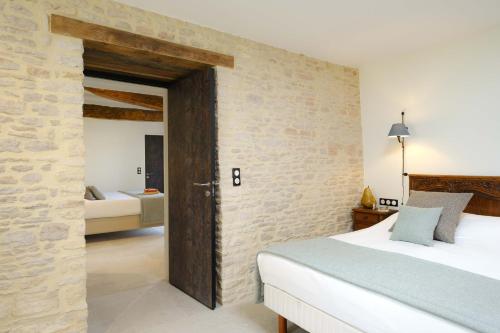 Katil atau katil-katil dalam bilik di Appartements La Grande Ferme Crépon - à la campagne 5mn d'Arromanches et 10mn de Bayeux