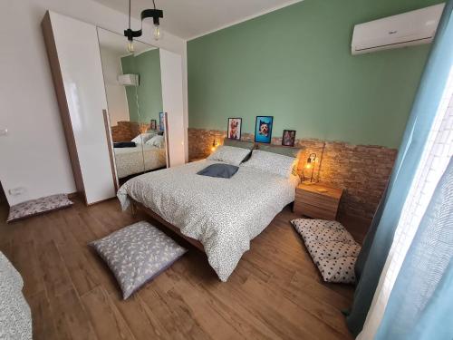 a bedroom with a bed and a large mirror at La Chicca di Milu' for Pet Lovers in Alcamo