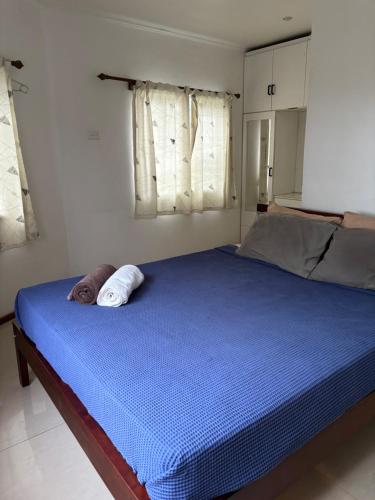 Ένα ή περισσότερα κρεβάτια σε δωμάτιο στο Happy home in Nadi
