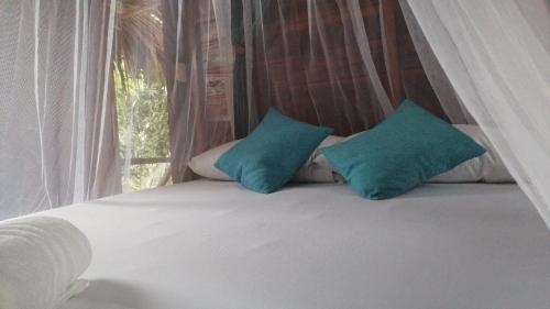 Una cama o camas en una habitación de Hostel Cattleya