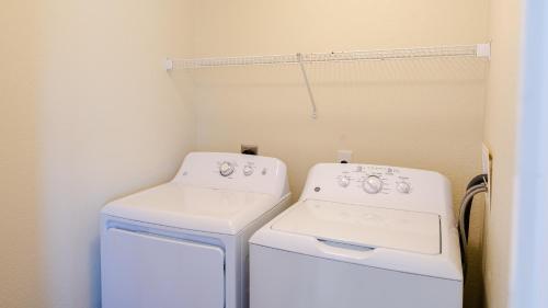 a laundry room with a washer and dryer at Watermen's Cabana 2B - 2-Bed, 1-Bath - Walk To BEACH Access & PET Friendly! in Waves