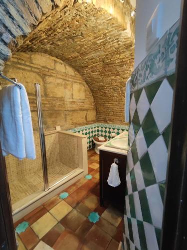 a bathroom with a shower and a sink at Home Sweet Casa de los Arcos Parking Free in Córdoba