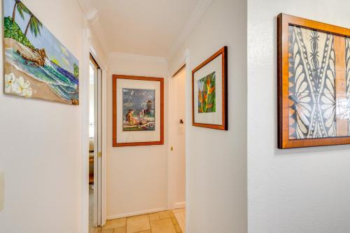 a hallway with paintings on the walls at Oceanfront Condo Stunning Sunrise and Ocean Views in Hauula
