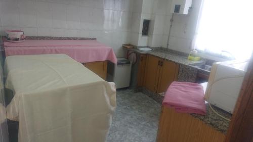 Kuchyň nebo kuchyňský kout v ubytování Melide Rooms