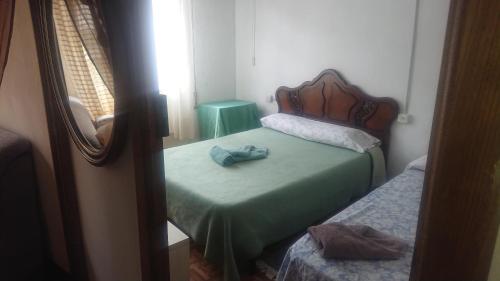 Postel nebo postele na pokoji v ubytování Melide Rooms