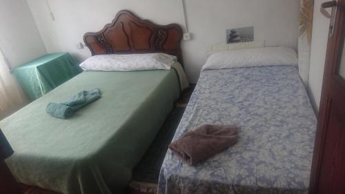 Ένα ή περισσότερα κρεβάτια σε δωμάτιο στο Melide Rooms
