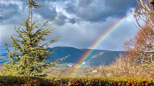 a rainbow in the sky with a mountain at La Mistraline, 2 bedrm 2 bath house in the heart of Provence in Caseneuve