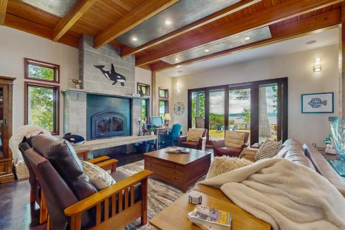 a living room with a couch and a fireplace at Puget Sound Orca Retreat in Poulsbo