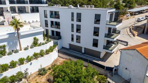 an aerial view of a white building at Prestige Apartment Primošten in Primošten