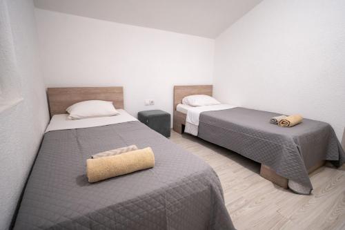 Кровать или кровати в номере Luna Apartments Gevgelija