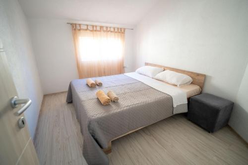 Кровать или кровати в номере Luna Apartments Gevgelija