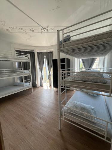 a bedroom with two bunk beds in a room at Bagetti hostel only for girls in Lisbon