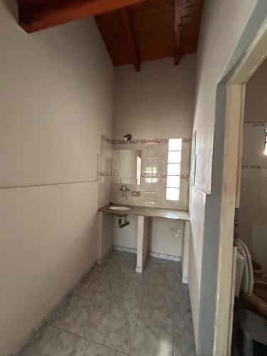 a bathroom with a sink and a window at Casa dos dormitorios in Bella Vista