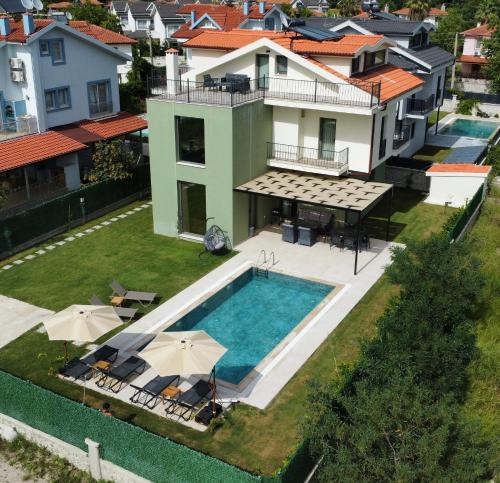 an aerial view of a house with a swimming pool at Villa Dream Göcek in Fethiye
