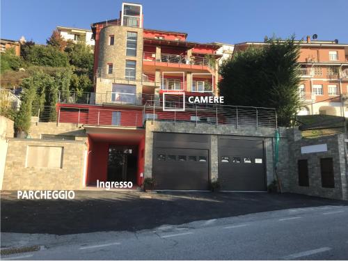 a building with a garage in front of it at B&B La fontana nelle Langhe in Rodello