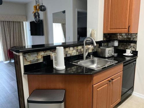 a kitchen with a sink and a counter top at Universal-Disney Dream 606S - 1 Bedroom in Orlando