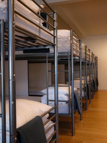 Postel nebo postele na pokoji v ubytování Blue House Dormitory
