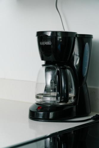 Apartamentos Ganesha Jacóにあるコーヒーまたはお茶