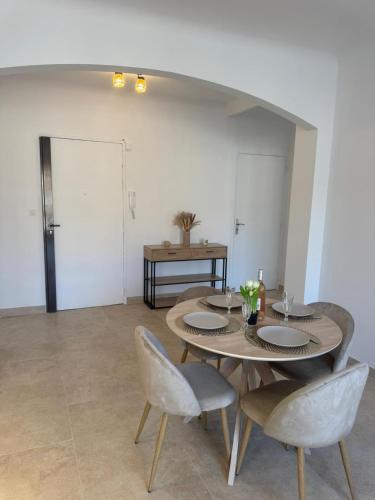 a dining room with a table and two chairs at Magnifique T2 avec grande terrasse in Le Cannet