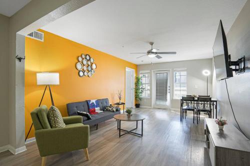 a living room with a couch and a table at Cozy 9-Person Apt w/ WiFi near Downtown Austin in Austin