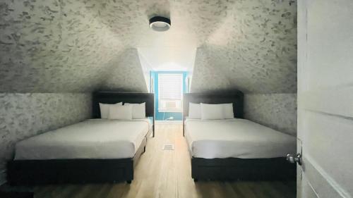 The Vibes Hotel, Trademark Collection by Wyndhamにあるベッド