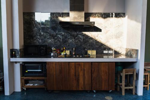 a bar in a room with a counter top at Daraga ดารกะ in Chiang Dao