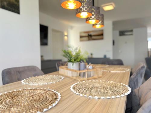 a wooden table with two plates on top of it at Sonnenschein in Stevensweert