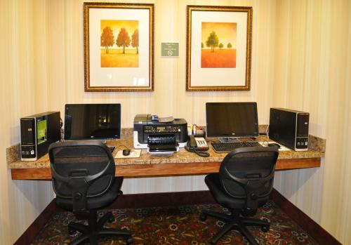 an office with a desk with two computers and a printer at Country Inn & Suites by Radisson, Conway, AR in Conway