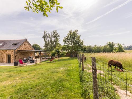 a barn conversion with a sheep in a field at Évasion champêtre entre Ancenis et Nantes - Maison rénovée avec jardin clos, pêche et animaux - FR-1-306-873 in Vallons-de-l'Erdre