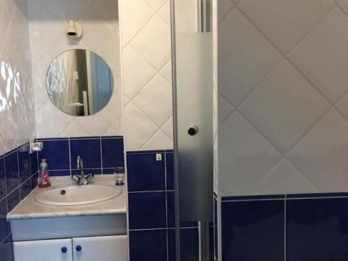 a bathroom with a sink and a mirror at Appartement familial avec parking, balcon vue mer, proche plages - FR-1-306-959 in La Turballe