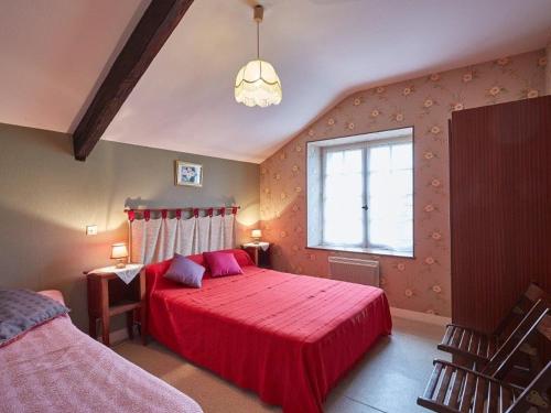 a bedroom with a red bed and a window at Charmante Maison Familiale à la Campagne, Proche Forêt, avec Wifi, Ping-Pong et Panier de Basket - FR-1-306-1152 in Le Gâvre
