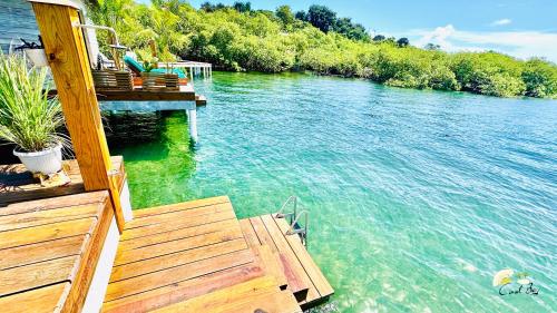 a dock on a boat in the water at CoralBay Bungalows Solarte in Solarte