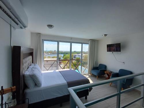 Postel nebo postele na pokoji v ubytování Casa Linda Isla Loft- Ocean View- Shared Pool