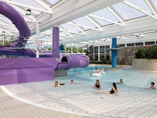 a group of people swimming in a swimming pool at Type2 holiday home in Hanstholm in Hanstholm